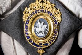 Great Britain, The Most Noble Order of the Garter, a magnificent Lesser George Sash Badge, with central agate cameo of St George and the Dragon by Benedetto Pistrucci set in a fine 22 carat gold and blue enamel mount by William Clutton, with engraved presentation inscription on the reverse Estimate £100,000-150,000