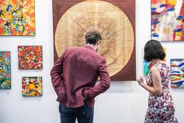 visitor exploring art at hong kong fair 2018