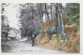 Post card ‘rue Daubigny, Auvers-sur-Oise’ covered with the painting ‘Tree Roots’ (1890) by Van Gogh, ©arthénon