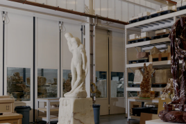 The large fabrication hall in Barry X Ball’s studio. On the left, Ball’s Pietà (2011–22), sculpted from translucent white Iranian onyx (after the Pietà Rondanini (1552–64) by Michelangelo Buonarroti). To the right, the “arabescato” Saint Bartholomew Flayed – Ascension (2011–21), created from French Rouge du Roi marble (after San Bartolomeo Scorticato (1562) by Marco d’Agrate). Photo: Vincent Tullo.