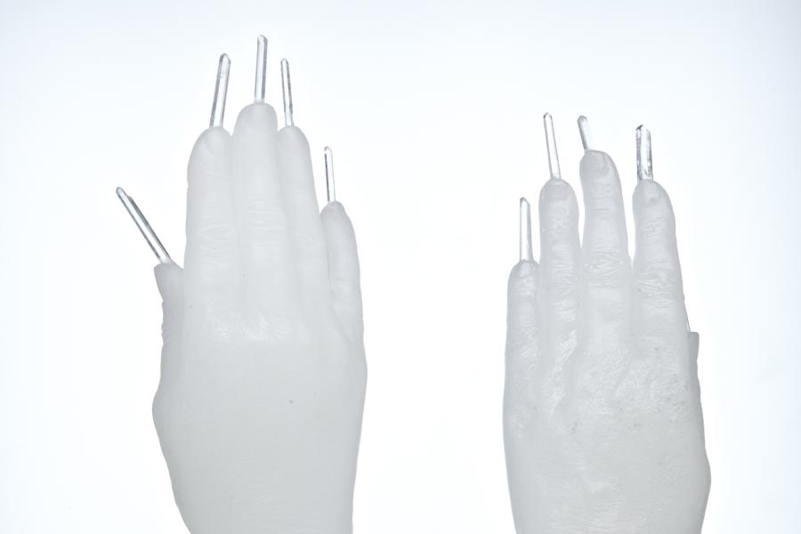 Marina Abramović The Communicator, 2012 Two clear wax hands with clear crystal stones, glass pedestal 25 x 10 x 5 cm © Marina Abramović Courtesy Marina Abramović Archives