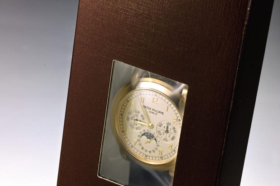 Lot 127 Property Of A Private Collector Patek Philippe A Very Fine And Rare Yellow Gold Automatic Minute Repeating Perpetual Calendar Wristwatch Cathedral Gongs, Moon-Phases And 24-Hour And Leap Year Indication In Original Factory Double Seal  Ref 5074 Sold In 2013 Est. $300/500,000 Sold for $ 370,000