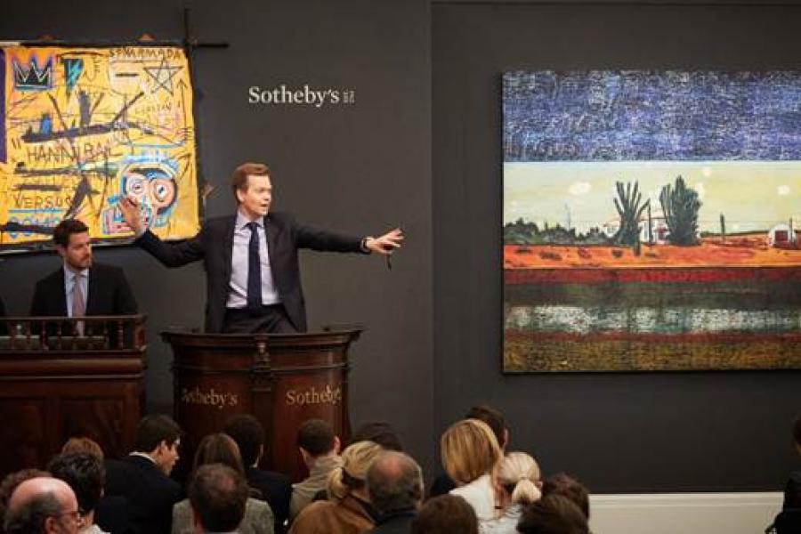 Chairman of Sotheby’s Europe, Oliver Barker, fields bids at Sotheby’s sales of Italian and Contemporary Art.