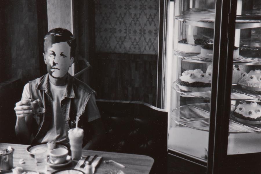 Lot 101 David Wojnarowicz 'Rimbaud In New York' (In Diner) signed, titled, dated, and editioned '1/3' in ink on the reverse, framed, Whitney Museum of American Art exhibition and P. P. O. W., Inc., labels on the reverse, 1978, printed in 1990, no. one in an unrealized edition of 3 7 1/8  by 9 1/2  in. (18.1 by 24.1 cm.) Estimate $12/18,000