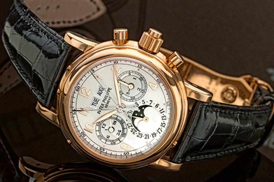 Patek Philippe A Fine Pink Gold Perpetual Calendar Split Seconds Chronograph Wristwatch with Moon-Phases Leap Year and 24 Hour Indication Ref 5004 Mvt 879877 Case 4115668 made in 2004 Estimate 120,000–180,000 USD