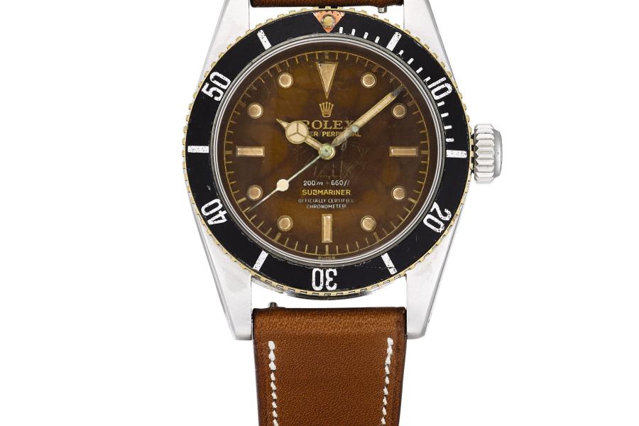 LOT 210 ROLEX ‘FOUR LINE BIG CROWN’ SUBMARINER, REF 6538 STAINLESS STEEL WRISTWATCH WITH TROPICAL DIAL CIRCA 1959  CHF 100 000-200 000/USD 101 000-202 000