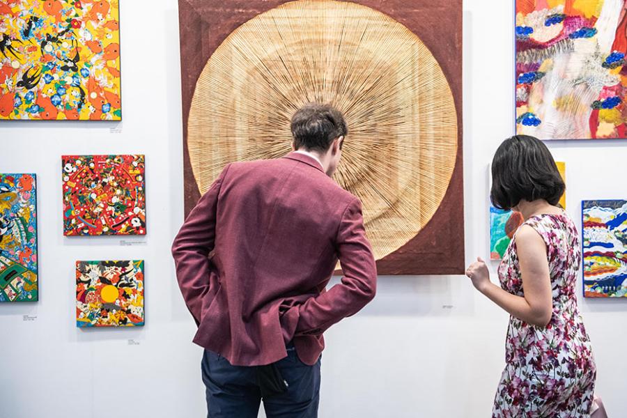 visitor exploring art at hong kong fair 2018