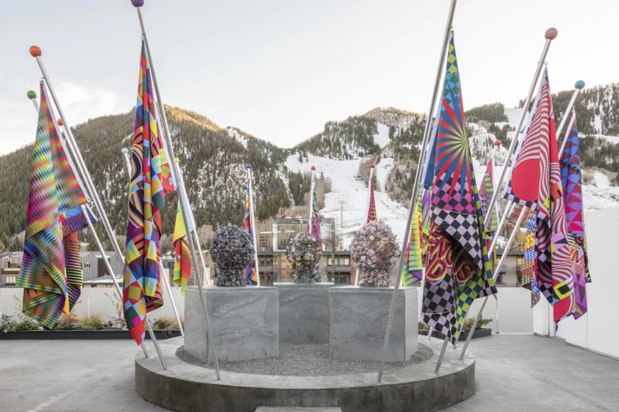 Fifteen flags, used as part of Gibson’s performance for the 2022 exhibition The Spirits are Laughing, on display outside the Aspen Art Museum. Courtesy of Jeffrey Gibson, Sikkema Jenkins & Co, New York, Roberts Projects, LA; and Stephen Friedman Gallery, London. Photo by Tony Pr