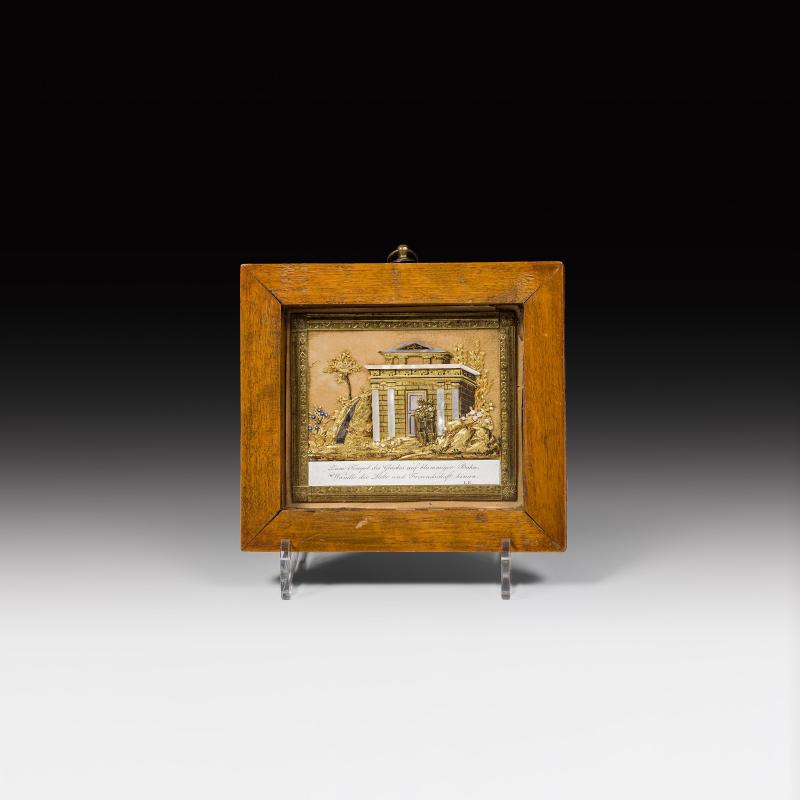 J. J. Endletzberger Schätzpreis € 550 - 1.000 (St. Pölten 1779-1856 Wien) Kunstbillet Wien, um 1825 Collage aus koloriertem Papierprägedruck und Goldpapier auf Seidengaze, Perlmutt; Spruch: "Zum Tempel des Glückes auf blummiger Bahn,/Wandle die Liebe und Freundschaft hinan", monogrammiert "I.E."; gerahmt; 8 × 9,5 cm (ohne Rahmen)