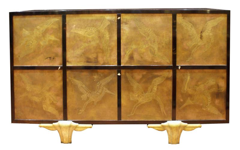 A cabinet by Eugène Printz (1889-1948) and Jean Dunand (1877-1942) A cabinet in rosewood, 2 doors in decorated metal, bases in bronze, interior in sycamore. 167 x 40 x 100 cm. France, around 1940. Robertaebasta di roberta tagliavini