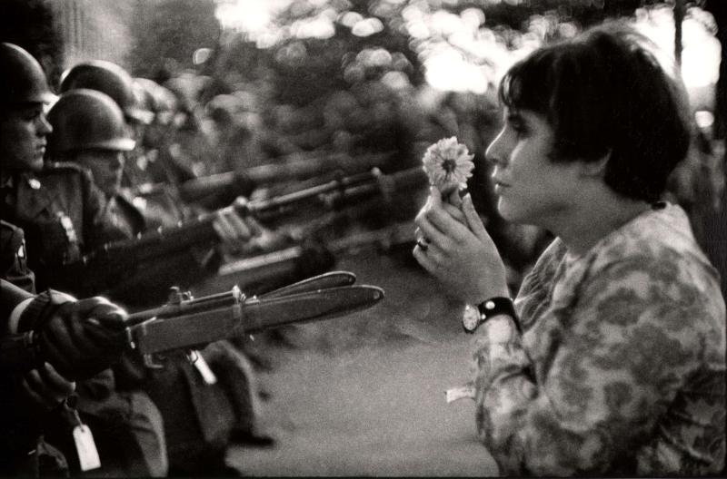 Young girl holding a flower, demonstration against the war in Vietnam, Washington, 1967