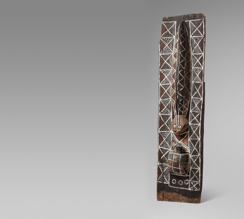 AN NKANU INITIATION PANEL  Angola/Democratic Republic of the Congo  From a kikaku initiation hut, the slender rectangular panel carved in high relief with a viper facing a tortoise, painted all over with geometric design in various colors.  Schätzpreis: €10.000 - €15.000