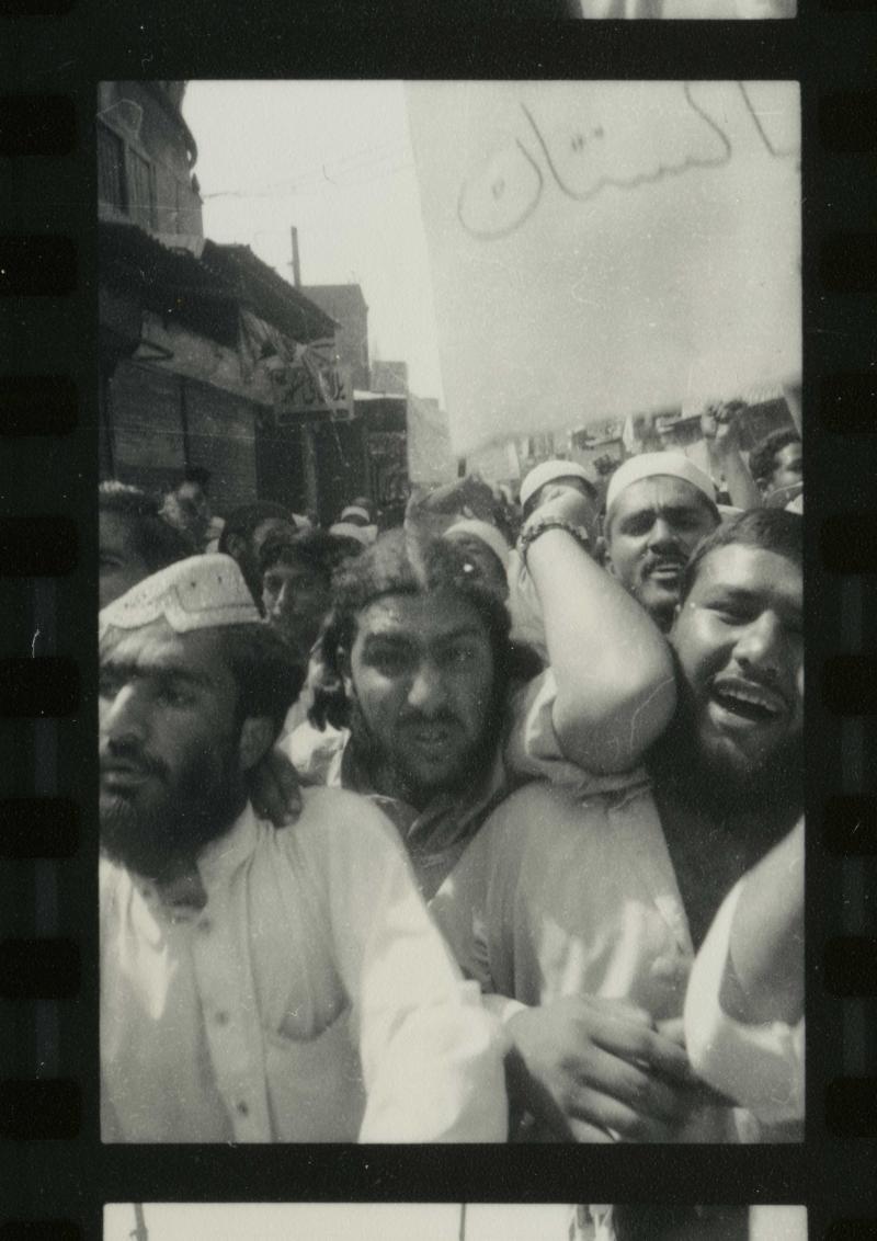 After 9/11, Pakistan's religious parties organize demonstrations against the possibility of an American attack on Afghanistan. Crowds carry banners written in English: “Osama is hero of Islam”, and “Bush trusts in military power, we trust in Allah.” Peshawar, September 2001, Pakistan.