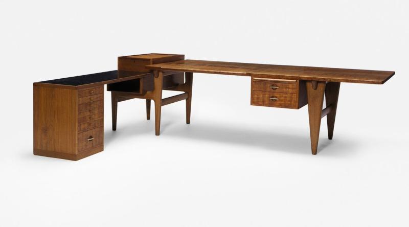 Lot 329 Hans Wegner An Important And Rare Executive Desk With Return with ink stamp TORBEN ØRSKOV & Co./JAGTVEJ 169-2100 KØBENHAVN Ø teak, oak, brass, black laminate Overall: 30 1/2 x 109 x 79 1/2  in.  (77.5 x 277 x 202 cm.) 1955 produced by Johannes Hansen, Copenhagen, Denmark Est. $50/70,000 Sold for $ 87,500