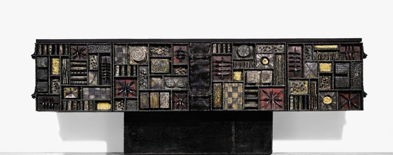 Lot 187 Property From A Private New York Family Paul Evans "Sculpture-Front" Cabinet lacquered and gilt steel and slate 35 x 99 x 22 3/4  in. (88.9 x 251.5 x 57.8 cm)  circa 1970 executed by Paul Evans Studio, New Hope, PA Est. $100/150,000 Sold for $ 162,500