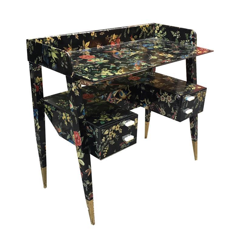 Robertaebasta di roberta tagliavini Piero Fornasetti and Gio Ponti A desk  A desk designed c.1950 decorated with the 'Coromandel' pattern introduced in the 1960's. Lithographed wood, mahogany, bakelite and brass, with maker's disc to one drawer 'Fornasetti Milano'. Circa: 1956 90cm x 44cm x 79.5cm