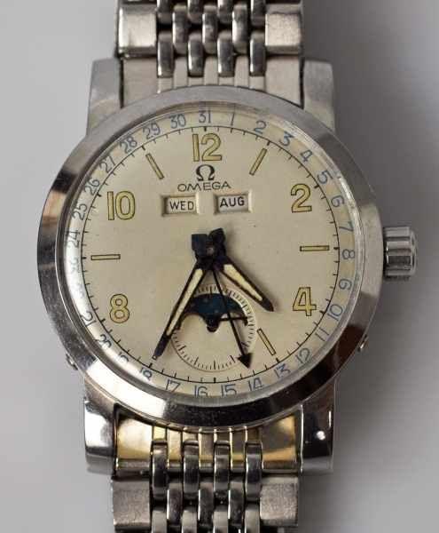 OMEGA Cosmic, Handaufzug, rundes Stahlgehäuse mit Mondphase, Tages- Datumsanzeige, Schweiz um 1947 mit Stahlarmband Mindestpreis:	1.000 EUR