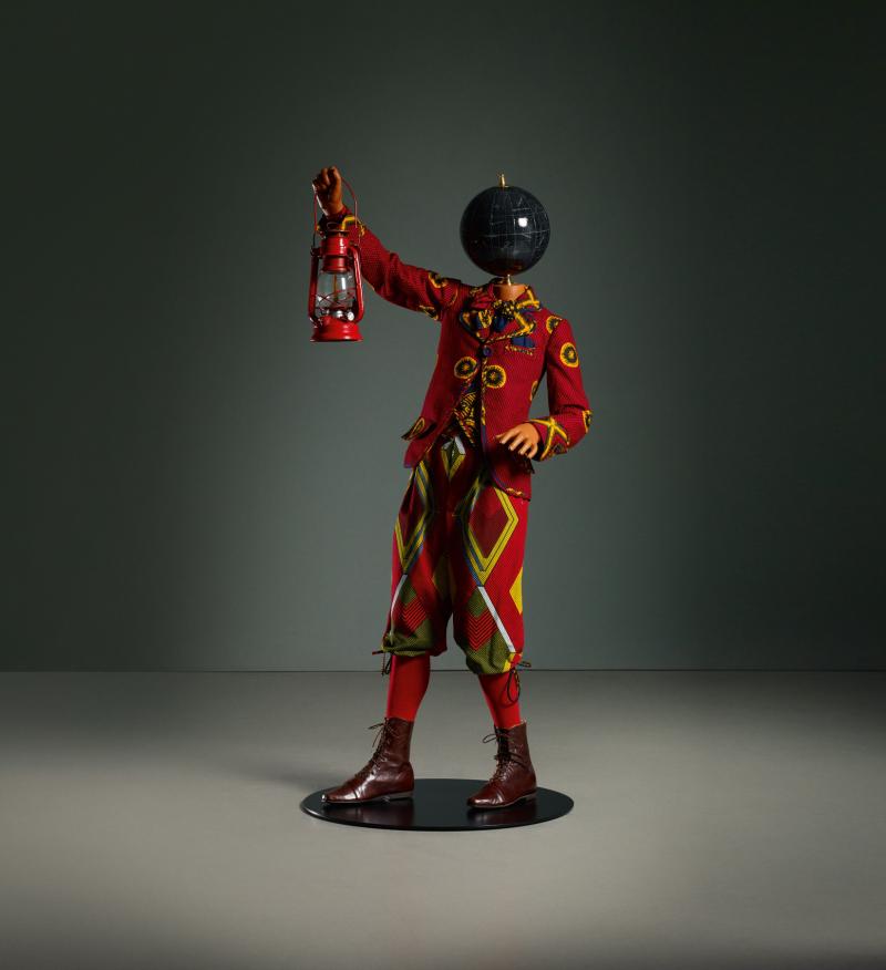 Lot 14 Yinka Shonibare Red Lantern Kid fiberglass mannequin, Dutch wax printed cotton textile, lantern, resin, metal, globe and steel baseplate 54 1/2 by 22 7/8 by 23 5/8 in. 138.5 by 58 by 60 cm. Executed in 2018. Estimate $100/150,000 Sold for $325,000