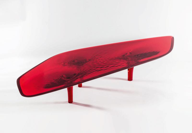 Lot 23 Zaha Hadid Liquid Glacial Colour Coffee Table acrylic 15 3/4 by 106 1/4 by 35 3/8 in. 40 by 270 by 92.5 cm. Executed in 2012, this work is the only red version produced from the edition of 8, plus 2 prototypes and 2 artist's proofs with David Gill Gallery.  Estimate $100/150,000 Sold for $300,000