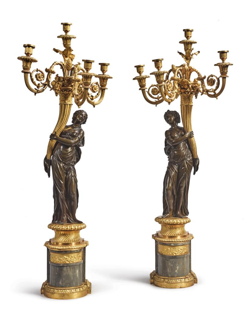 Lot 825 A PAIR OF LOUIS XVI GILT AND PATINATED BRONZE FOUR-LIGHT FIGURAL CANDELABRA ATTRIBUTED TO FRANCOIS REMOND, CIRCA 1785 on bleu turquin marble bases; drilled for electricity. With a later pair of round fluted white marble columns. height 42 in.; max. width 18 in.; width of base 8 in.; depth of base 7 in.; column height 39 1/2 in. 106.5 cm; 45.5 cm; 20 cm; 18 cm; 100 cm Estimate $60/100,000 Sold for $ 112,500