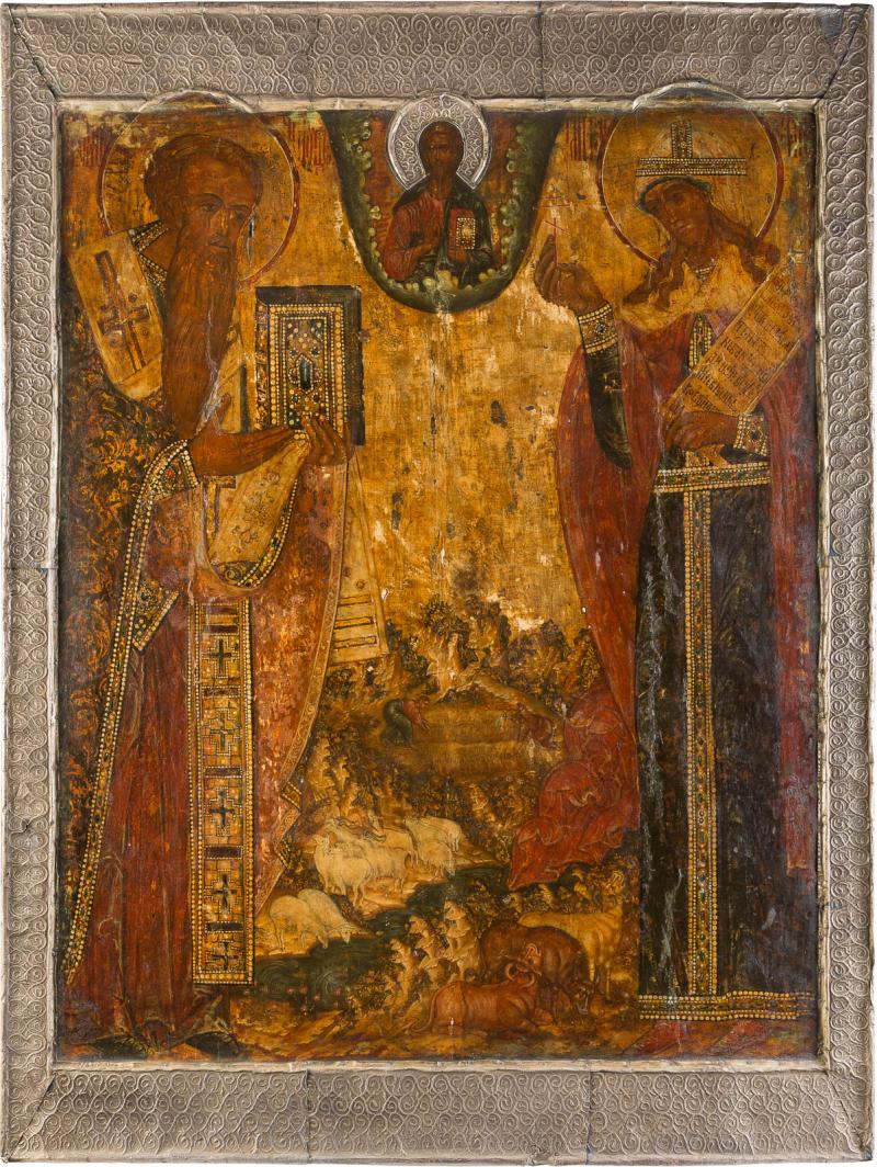 MONUMENTALE IKONE MIT DEM HEILIGEN SPIRIDON UND DER HEILIGEN PARASKEWA MIT BASMA AUS EINER KIRCHEN-IKONOSTASE, Russland, 17. Jh. Kowtscheg, Eitempera auf Kreidegrund, partielle Vergoldung. 110 x 83,5 cm. Erlös 31.250,-€