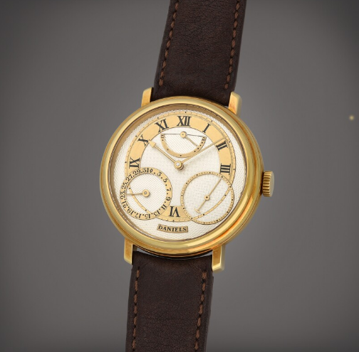 George Daniels, London  Anniversary Number 01 An Historically Important and Early Yellow Gold Manual Winding Wristwatch with Date and Up/Down Indication - Estimate: in excess of CHF 500,000