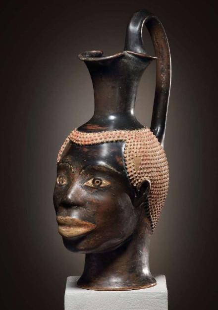 Oinochoe in the form of an African’s head. Class of Louvre H 62. Athens, c. 470 B.C. Terra cotta. H. 22 cm. Cahn, Switzerland